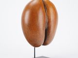 a close up of a sculpture of a coffee bean on a stand