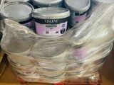several cans of paint are wrapped in plastic on a pallet