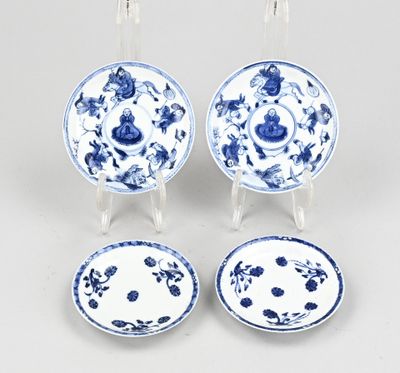 three chinese blue and white plates and a saucer