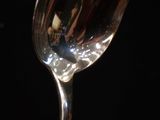 a close up of a glass of wine on a table