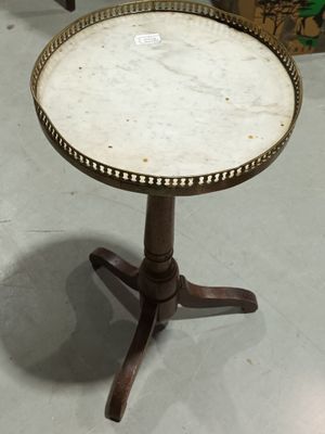 a small table with a marble top on a stand