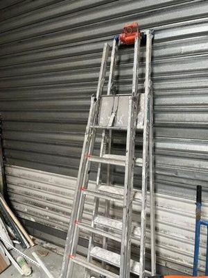 a ladder that is leaning against a wall in a garage