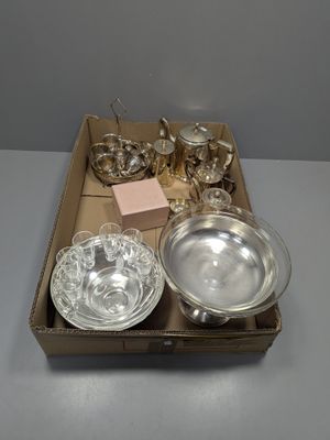 a box of silverware sitting on a table