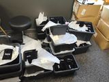 many pieces of luggage sitting on the floor in a room