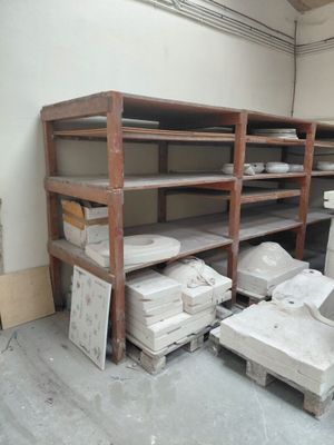 a room that has a lot of boxes and boxes on the shelves