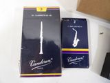 a box of cigarettes and a box of saxophones on a table