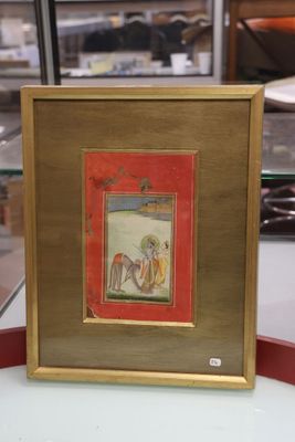 tableau représentant un homme et une femme à cheval, dans un cadre rouge