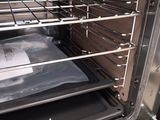 a bag of food sitting inside of an oven