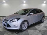 the ford focus is parked on a checkered floor in a garage
