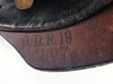 a close up of a hat on a white surface