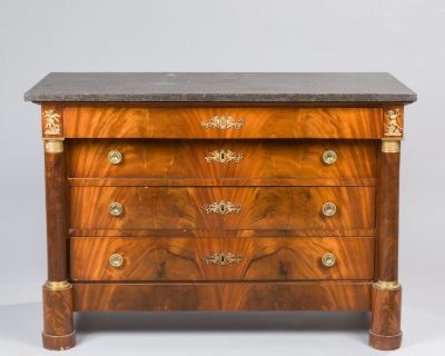 an antique chest of drawers with marble top
