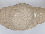 a cream colored bowl with a decorative design on it