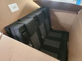 a cardboard box with a bunch of luggage inside of it