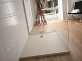 an image of a bathroom with a shower and a chair