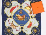a blue scarf with a picture of a horse drawn carriage on it