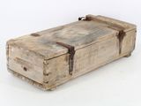 a small wooden box with a handle on a white surface