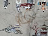 a close up of a fabric with a picture on it