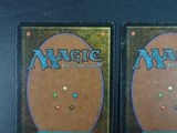 two decks of magic the gathering are shown on a table