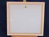 an easel with a blank canvas on it against a blue background