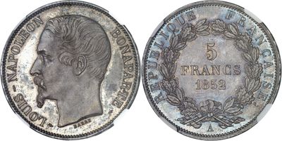 a close up of a silver coin with a woman ' s face on it