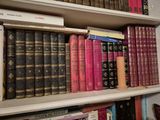 many books that are on the shelves in the room