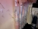 many rolls of plastic wrap on the wall next to a coffee maker