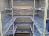 a very long shelf in the middle of the room