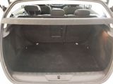 the back of a car with the trunk open and the seats down