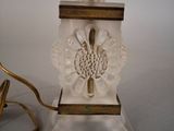 a lamp that is sitting on a table next to a lamp