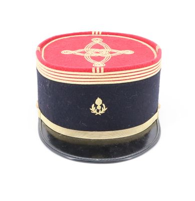 a red and blue hat with gold trim on a white background