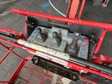 an image of a machine that is working on a piece of machinery