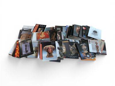 a pile of books with pictures of people on them