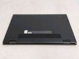 a laptop that is sitting on a white surface