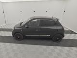 a picture of a small car parked in a garage
