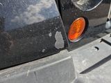 a close up of a car ' s tail light and bumper