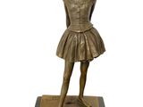 bronze statue of a young girl in a tutu skirt on a marble base