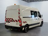 a white van that is parked inside of a building