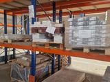 a large warehouse filled with lots of boxes and pallets