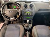 a picture of a dashboard of a car in a showroom