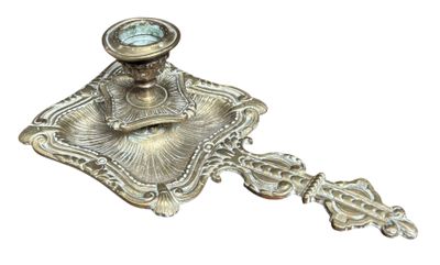 an image of a silver candle holder with a clock on it