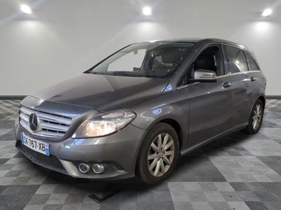 the mercedes b - class is parked on a checkered floor