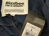 the label on a blue jacket that says bizzleee fun is serious