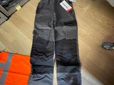 a pair of work pants on the floor in a store