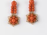 pair of coral and gold earrings with filigree details