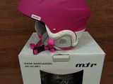 pink helmet on top of a white box on a wooden surface