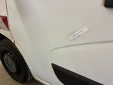 a white van with a sticker on the side of it ' s door