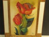 painting of two red roses in a gold frame on a white surface
