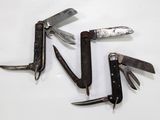 many different types of knives on a white surface