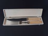 a picture of a set of knives in a case