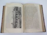 an open book with a picture of a train on it
